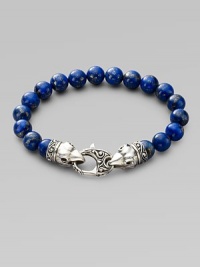 A welcome touch of color, strung with 10mm lapis beads and a raven's head sterling silver clasp. About 9¼ long Imported