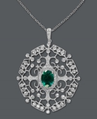 Introducing the unique styles of Brasilica by Effy Collection. This stunningly ornate pendant features an intricate, scrolling pattern decorated by round-cut diamonds (3/8 ct. t.w.) that highlight an oval-cut emerald (1-1/8 ct. t.w.). Set in 14k gold. Approximate length: 18 inches. Approximate drop length: 1-2/3 inches. Approximate drop width: 1-1/5 inches.