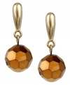 The bronze age is here. The metallic bronze tint on these Kenneth Cole New York cherry bead drop earrings lends a warm touch to your seasonal collection. Set in gold tone mixed metal. Approximate drop: 1 inch.