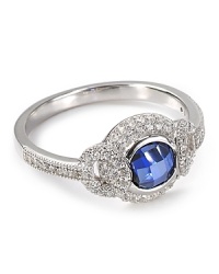 A dazzling sapphire stone illuminates a solid sterling silver band on this Crislu ring, surrounded by elegant cubic zirconia stones.