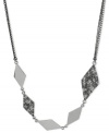 Diamond shapes dance around this frontal necklace from Kenneth Cole New York. Crafted from silver-tone mixed metal, the necklace is offset with glimmering pave glass crystal accents. Approximate length:19 inches + 3-inch extender. Approximate drop: 4/5 inch.