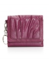 Pleats fan across the front of this pretty wallet like flower petals. The perfect little companion for a chic night out.