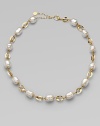 This unique and chic design of baroque pearls and three dimensional 18k gold oval links is simply stunning.12mm baroque white organic man-made pearls18k goldplated sterling silverLength, about 16 to 18 adjustableLobster clasp closureImported 