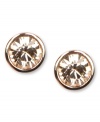 Rosy outlook. The warm hues of Givenchy's bezel-set stud earrings feature round-cut glass stones. Crafted in rose gold tone mixed metal. Approximate diameter: 1/2 inch. Approximate drop: 3/4 inches.