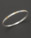 A beautiful bangle from Gurham, crafted with hammered white silver with 24 Kt. yellow gold stud accents.