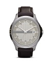 Crafted of sleek stainless steel this watch from Armani Exchange perfects easy-cool. The streamlined design is accented by leather band giving it a functional yet stylish finish.