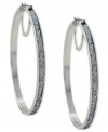 Hit the right notes with these hoop earrings from Jessica Simpson. Crafted from silver tone mixed metal, they also shine with silver glitter. Approximate drop: 2-1/2 inches. Approximate diameter: 2-1/2 inches.