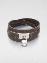 This effortless style features a chic logo accented padlock charm on a supple wrapped leather strip. LeatherSilvertone brassLength, about 25Buckle closureImported 