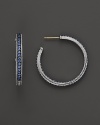 Sparkling sapphires detail a classic pair of sterling silver hoop earrings from Judith Ripka.