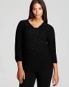 A constellation of beading sparkles from a stunningly draped Eileen Fisher Plus sweater for an effortlessly elegant look.