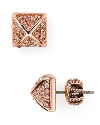 Punk-inspired style finds its pretty side with this pair of Juicy Couture stud earrings, accented by glam-rock crystals.