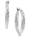 Twists and turns add suspenseful appeal to these earrings from Charter Club. The classic hoop has been embellished with crystal shimmer. Crafted in silver tone mixed metal. Approximate drop: 9/10 inch.