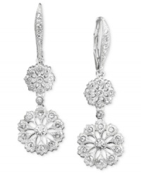 Glorious medallions highlighted by crystals delectably dangle from these gorgeous drop earrings set in silvertone mixed metal. Approximate drop: 1-1/2 inches.