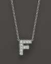 From the Tiny Treasures collection, a diamond F necklace. With signature ruby accent. Designed by Roberto Coin.