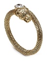 Put a fierce spin on your look with this panther coil bracelet from Carolee. With gleaming eyes and gleaming links, this bold cuff hints at your wild side.