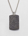 From the Palu Collection. The hand-hammered design motif of the Palu collection distinguishes a blackened bronze dog tag pendant, connected by a sterling silver bale to a bold chain of bright stainless steel.Bronze and sterling silverStainless steelChain length, about 24Pendant, about 2L X 1WLobster claspMade in Bali