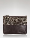 Pouch your bets with this Rebecca Minkoff accessory, designed to send a texture message in calf hair with leather trims.