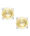 Simply elegant. Arabella's stud earrings sparkle with round-cut yellow Swarovski zirconias for a vibrant touch. Set in sterling silver. Approximate diameter: 1/3 inch.