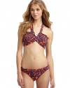 THE LOOKSpirited abstract animal and floral printAdjustable halter straps tie at neckBands crisscross at center with V-shaped openingPadded cups and side boningBack clasp closureTHE MATERIAL80% nylon/20% spandexFully linedCARE & ORIGINHand washImportedPlease note: Bikini bottom sold separately. 