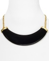 A bold polished resin horn punctuates this Kenneth Jay Lane necklace, which lends a fashion-forward feel to a simply styled 22-karat gold plated chain.