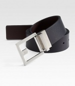 An essential, reversible design fit for any look with a brushed silvertone buckle. About 1¼ wide Imported