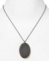 Elizabeth and James put a striking spin on the perennially chic pendant necklace with an oversized onyx station. It's understated design epitomizes edgy elegance.