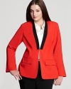 Embrace modern design as clean lines and block colors combine for a sleek VINCE CAMUTO Plus blazer. Style with slim pants for a chic, structured silhouette.