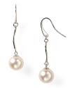 Luminous and versatile. Pearls are always a classic, and this pair of drop earrings from Majorica is a delicate way to wear them.