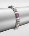 From the Muse Collection. An iconic caviar texture in sleek sterling silver accented with a pretty pink sapphire station. Sterling silverPink sapphireLength, about 7.5Box and tongue closureImported 