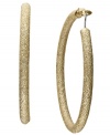 A style must-have, every girl needs at least one pair of hoops in her accessory collection. INC International Concepts' style features a diamond dust design set in gold tone mixed metal. Approximate diameter: 2 inches.