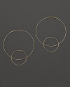 Like magic, smaller hoops balance on 14K gold counterparts.