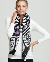 Filigree and florals lend elegant style to this large lightweight scarf from Theodora & Callum.