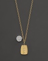 This gold necklace is engraved with LOVE and is paired with a diamond pavé medallion. Designed by Meira T.