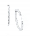 Timeless style with a hint of sparkle. Eliot Danori's traditional hoop earrings experience a dazzling touch with the addition of a seamless row of round-cut crystals. Set in silver tone mixed metal. Approximate diameter: 1-1/8 inches.