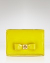 Petite in size, this Tory Burch card case comes dressed up in a bow and finished in pretty patent leather.