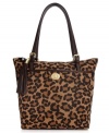 Get spotted wearing something wild with this spacious leopard print tote from Tommy Hilfiger. Sumptuous suede is accented with custom hardware, flirty tassel and signature stripe, making it the perfect marriage of preppy and posh.