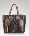 This Sam Edelman tote has a wild side. Coolly crafted in a snakeskin print, its exotic look will carry you miles and instantly update your daytime outfits.