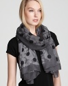 Flowers and dots in shades of gray cover this on-trend MARC BY MARC JACOBS oblong scarf.