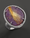 Diamonds circle a faceted rutilated quartz and purple charoite doublet in a sterling silver band. By Di Massima.