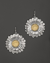 Blooming daises are detailed in 18K yellow gold accents on these Buccellati earrings.