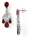 A rich cascade of ruby-red colored stones illuminates this pair of Nadri chandelier earrings, which flaunts an elegant allure, set off by rhodium plated metal.