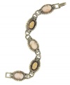 Cameo appearance. 2028's chain link bracelet features vintage inspiration in the form of a cameo motif. Crafted in brass tone mixed metal, opaque resin, and vintage German glass stones, it's sure to add a romantic sense of antique chic to your style. Approximate length: 7 inches.