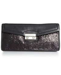 After-hours attire deserves exquisite style, like this party-perfect clutch form Cole Haan. Crafted in ultra-soft leather with sparkly sequin detailing, the surprisingly spacious interior holds cards, cash, phone and other mini must-haves.