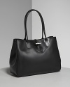 Longchamp Roseau tote. Classic style in soft leather tote with expandable side gussets for additional room. Double shoulder straps. Top magnetic snap along with toggle closure. Adjustable side snap closure detail. Interior zip, cell phone and additional pockets. Lined.