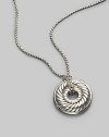 From the Carved Cable Collection. Pavé diamonds border a petite disk pendant with signature sculpted cable design, elegantly hanging from a sterling silver box chain. Diamonds, 0.15 tcw Sterling silver Length, about 17 Lobster clasp Imported