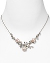 Take an elegant approach to accessorizing with this sterling silver and pearl frontal necklace from Judith Jack. With an intricate leaf and petal design it's a natural after-hours choice.