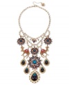 Get over the fashion hump. Betsey Johnson's fun bib necklace combines gold tone setting with crystal cup chain, glitter camel charms with multi-colored details and crystal accents, round medallions with flower and crystal accents, purple and blue teardrop with crystal accents. Set in antiqued gold tone mixed metal. Approximate length: 16 inches + 3-inch extender. Approximate drop: 6-1/2 inches.