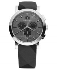 This Burberry watch features a beat check fabric strap and round stainless steel case. Chronograph dark gray engraved dial with silvertone stick indices, logo, date window and three subdials. Swiss made. Swiss movement. Water resistant to 50 meters. Two-year limited warranty.