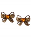 Tie these on for size. Betsey Johnson's stud earrings feature a whimsical bow motif with topaz-colored crystal accents and a heart detail in the center for a special touch. Crafted from brown gold-tone mixed metal. Approximate drop: 3/4 inch.