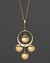 Hammered 14K yellow gold discs dance and dangle from a slim hoop.